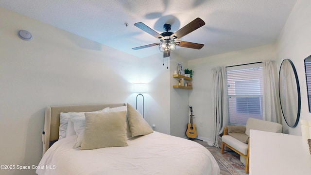 4047 Meander Pl Unit 205, Rockledge, FL 32955 - bedroom featuring baseboards, ceiling fan, and a textured ceiling