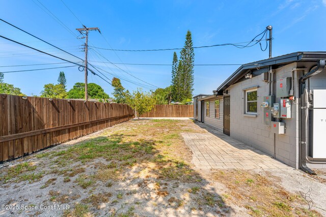fenced backyard featuring a patio