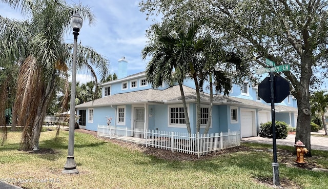 view of front of home featuring an attached garage, stucco siding, and roof with shingles