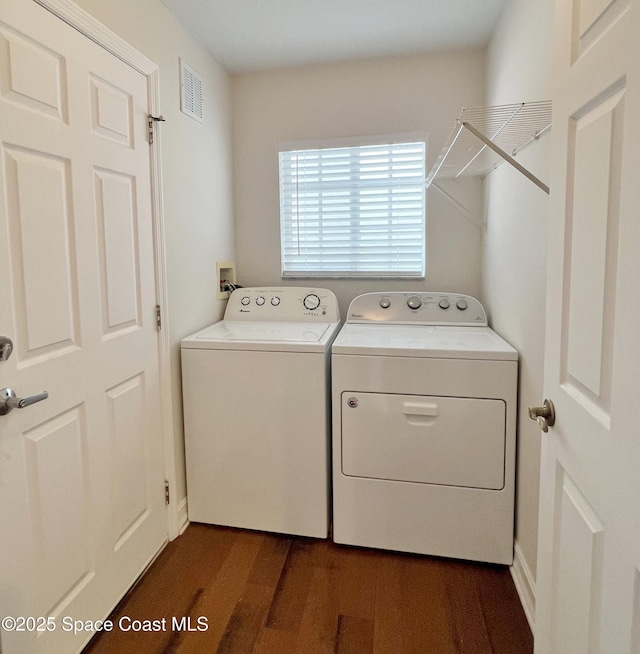 washroom featuring independent washer and dryer and dark wood-style flooring