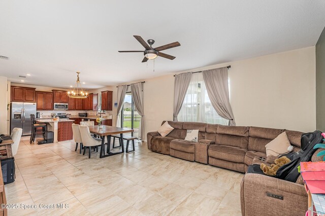 4109 Alligator Flag Cir, West Melbourne, FL 32904 - living room featuring a chandelier and ceiling fan