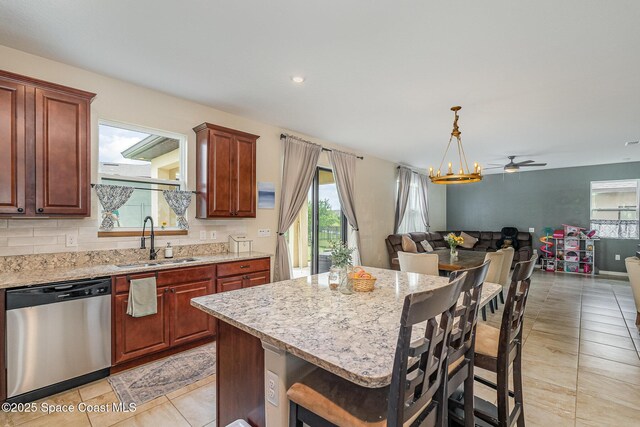 4109 Alligator Flag Cir, West Melbourne, FL 32904 - kitchen with dishwasher, a sink, healthy amount of natural light, open floor plan, and recessed lighting