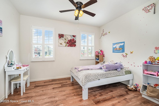 4109 Alligator Flag Cir, West Melbourne, FL 32904 - bedroom featuring wood finished floors, baseboards, and a ceiling fan