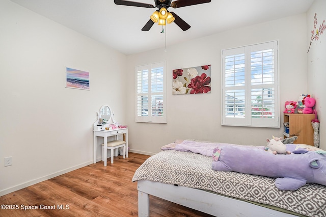 4109 Alligator Flag Cir, West Melbourne, FL 32904 - bedroom featuring light wood finished floors, baseboards, and ceiling fan