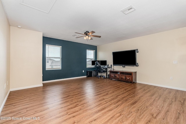 4109 Alligator Flag Cir, West Melbourne, FL 32904 - living area with light wood-style floors, ceiling fan, an office area, and baseboards