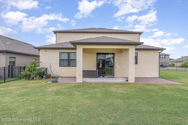 4109 Alligator Flag Cir, West Melbourne, FL 32904 - rear view of house with a patio, stucco siding, and a shingled roof