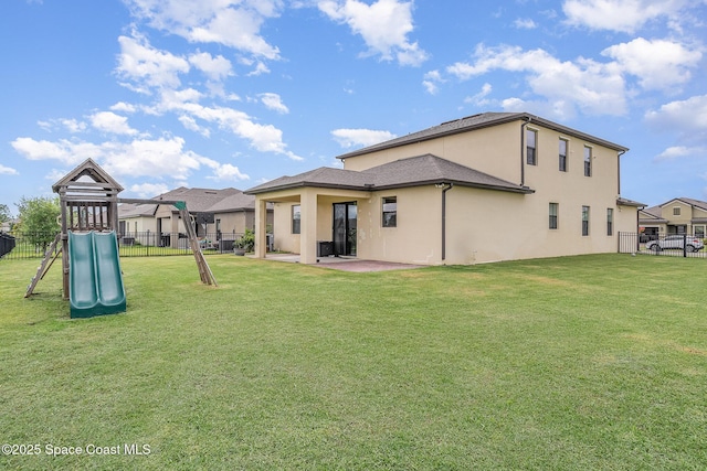 4109 Alligator Flag Cir, West Melbourne, FL 32904 - rear view of house featuring stucco siding, a playground, and a patio area