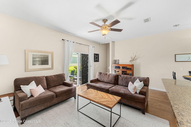 2650 Revolution St Unit 103, Melbourne, FL 32935 - living room featuring light wood-type flooring, ceiling fan, and baseboards