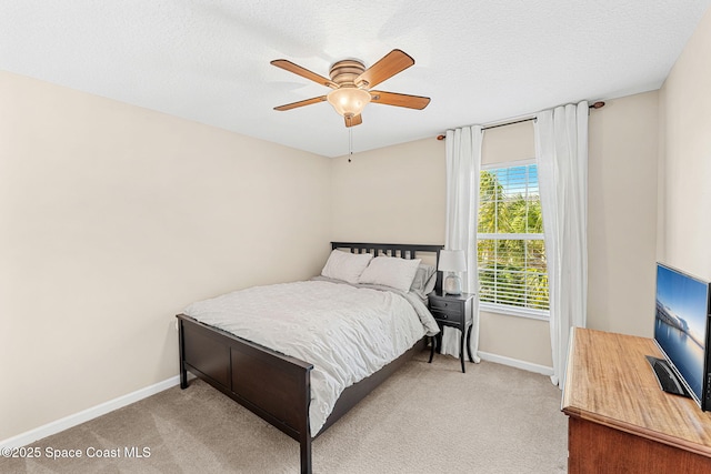 2650 Revolution St Unit 103, Melbourne, FL 32935 - carpeted bedroom featuring baseboards, a ceiling fan, and a textured ceiling