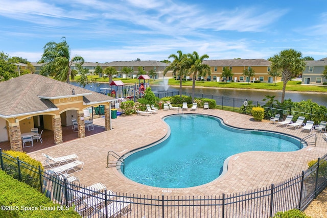 2650 Revolution St Unit 103, Melbourne, FL 32935 - community pool with fence, a patio, a residential view, and a water view
