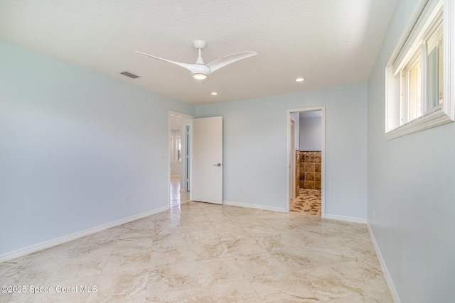 empty room with recessed lighting, a ceiling fan, and baseboards