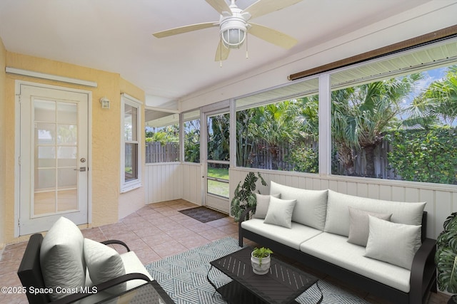 sunroom featuring an outdoor living space, a ceiling fan, and healthy amount of natural light