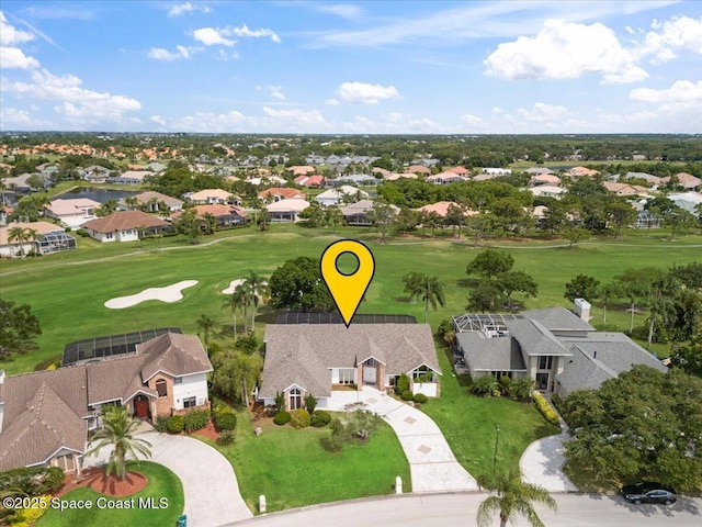 aerial perspective of suburban area featuring a golf club