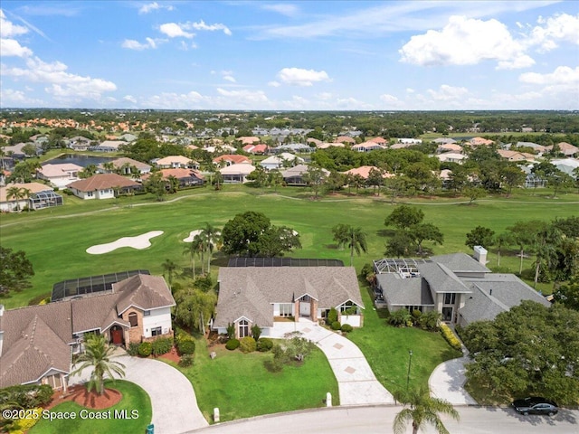 aerial view of residential area with a local golf course