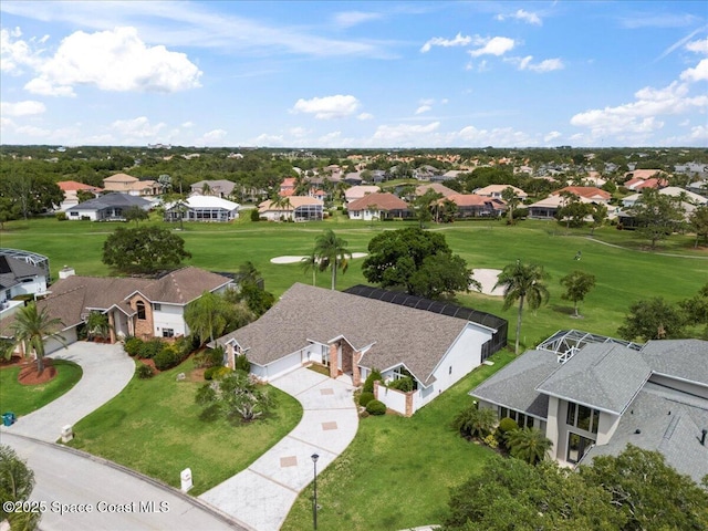 aerial view of residential area featuring a local golf course