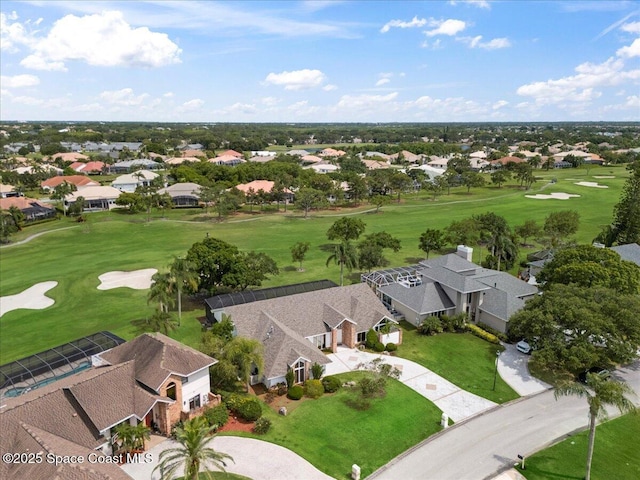 aerial view of residential area featuring a golf course