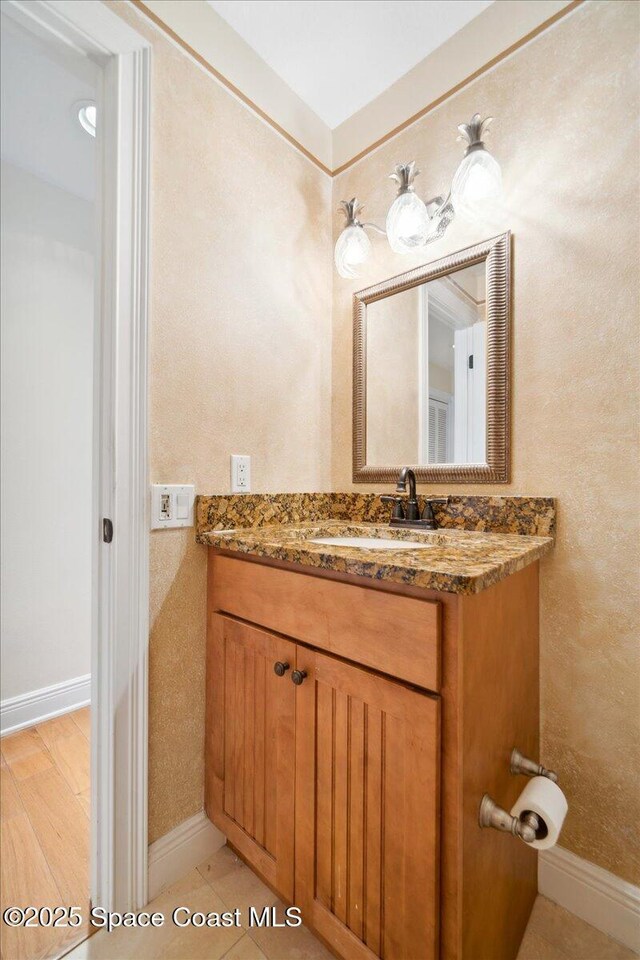 649 Spring Lake Dr, Melbourne, FL 32940 - bathroom featuring vanity and baseboards