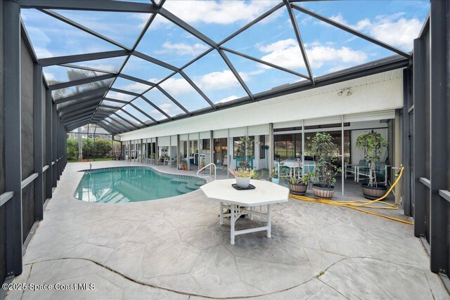 649 Spring Lake Dr, Melbourne, FL 32940 - swimming pool with a patio area and glass enclosure