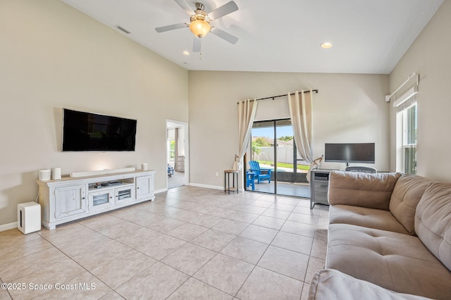 4065 Harvest Cir, Rockledge, FL 32955 - living room featuring baseboards, light tile patterned floors, a ceiling fan, recessed lighting, and high vaulted ceiling
