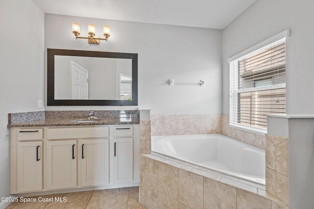 4065 Harvest Cir, Rockledge, FL 32955 - full bathroom featuring vanity, a bath, and tile patterned flooring