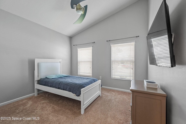 4065 Harvest Cir, Rockledge, FL 32955 - bedroom featuring lofted ceiling, light carpet, baseboards, and a ceiling fan