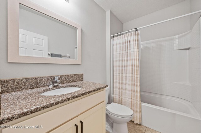 4065 Harvest Cir, Rockledge, FL 32955 - full bathroom featuring vanity, shower / tub combo, toilet, and tile patterned floors
