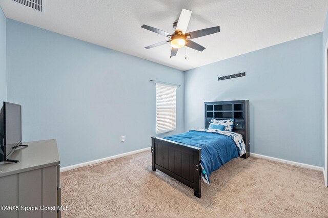 4065 Harvest Cir, Rockledge, FL 32955 - bedroom with light colored carpet, baseboards, and a ceiling fan