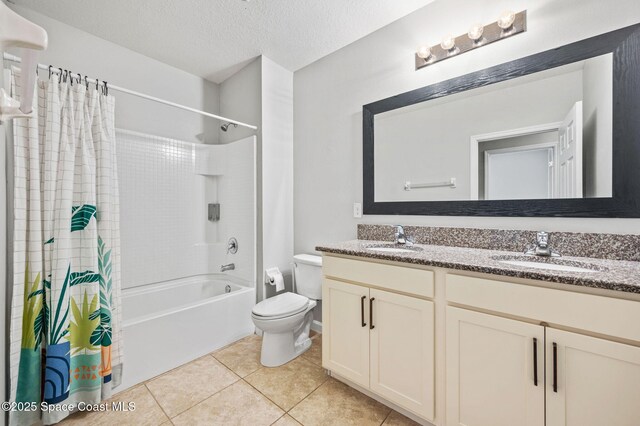 4065 Harvest Cir, Rockledge, FL 32955 - bathroom with shower / bath combination with curtain, double vanity, toilet, tile patterned floors, and a textured ceiling