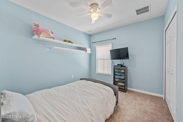 4065 Harvest Cir, Rockledge, FL 32955 - bedroom with a closet, carpet, baseboards, and ceiling fan