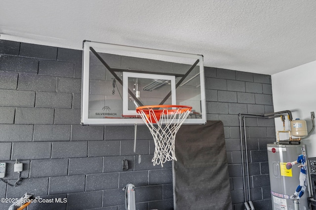 4065 Harvest Cir, Rockledge, FL 32955 - detailed view of water heater, concrete block wall, and a textured ceiling
