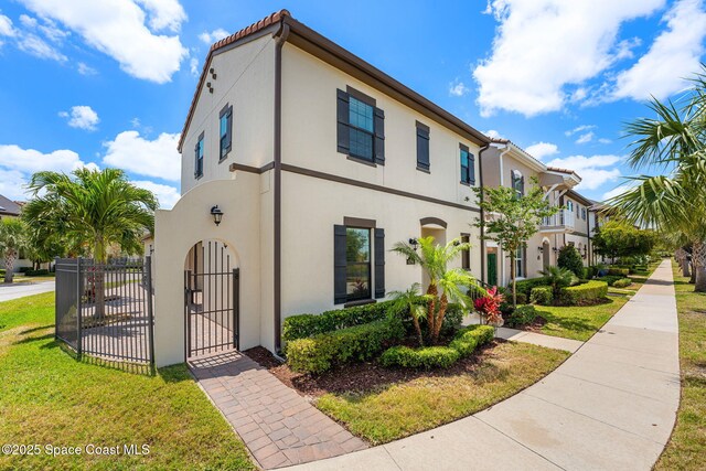 6794 Vista Hermosa Dr, Melbourne, FL 32940 - view of front of property featuring a gate and stucco siding