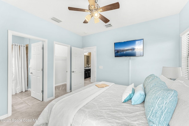 6794 Vista Hermosa Dr, Melbourne, FL 32940 - bedroom featuring light carpet, a spacious closet, baseboards, and a ceiling fan
