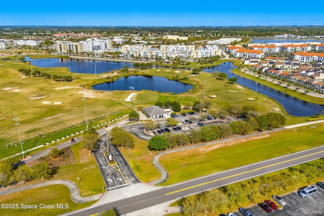 6794 Vista Hermosa Dr, Melbourne, FL 32940 - bird's eye view of a large body of water, a local golf course, and apartment complex / building