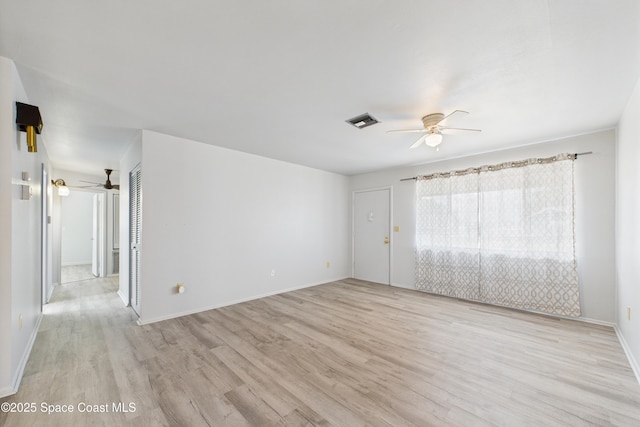 959 Eyerly Ln NE, Palm Bay, FL 32905 - empty room with a ceiling fan and light wood-style flooring