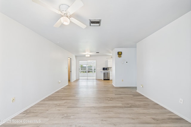 959 Eyerly Ln NE, Palm Bay, FL 32905 - unfurnished living room featuring a ceiling fan and light wood-type flooring
