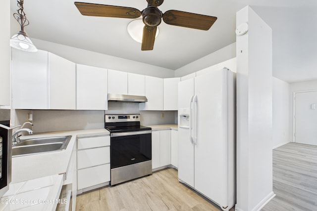 959 Eyerly Ln NE, Palm Bay, FL 32905 - kitchen with white refrigerator with ice dispenser, stainless steel electric stove, under cabinet range hood, light wood-style flooring, and light countertops