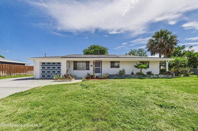 959 Eyerly Ln NE, Palm Bay, FL 32905 - ranch-style house featuring a garage and concrete driveway