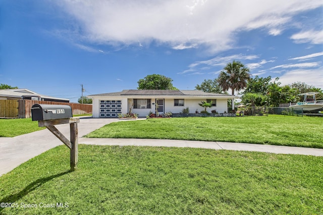 959 Eyerly Ln NE, Palm Bay, FL 32905 - ranch-style house featuring driveway and an attached garage