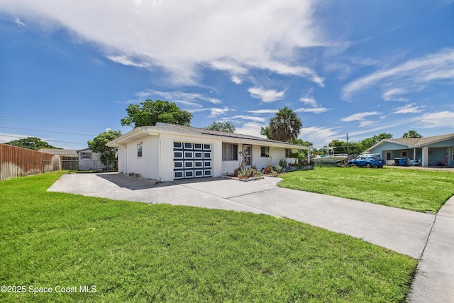 959 Eyerly Ln NE, Palm Bay, FL 32905 - view of front facade featuring a garage and concrete driveway