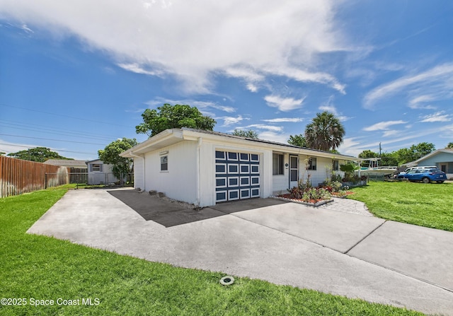 959 Eyerly Ln NE, Palm Bay, FL 32905 - view of front of house featuring concrete driveway and a garage