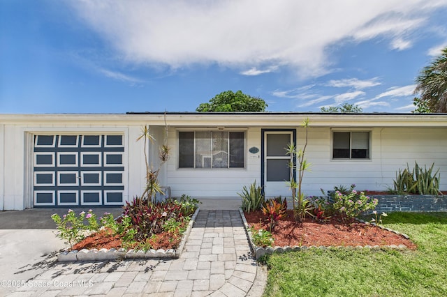 959 Eyerly Ln NE, Palm Bay, FL 32905 - ranch-style home with a garage