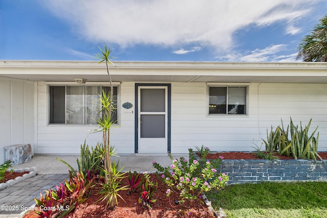 959 Eyerly Ln NE, Palm Bay, FL 32905 - doorway to property with covered porch