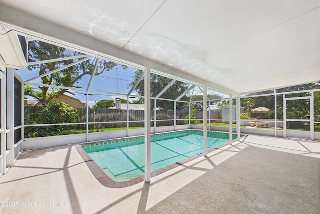 959 Eyerly Ln NE, Palm Bay, FL 32905 - view of swimming pool with a patio area, a fenced backyard, a lanai, and a shed