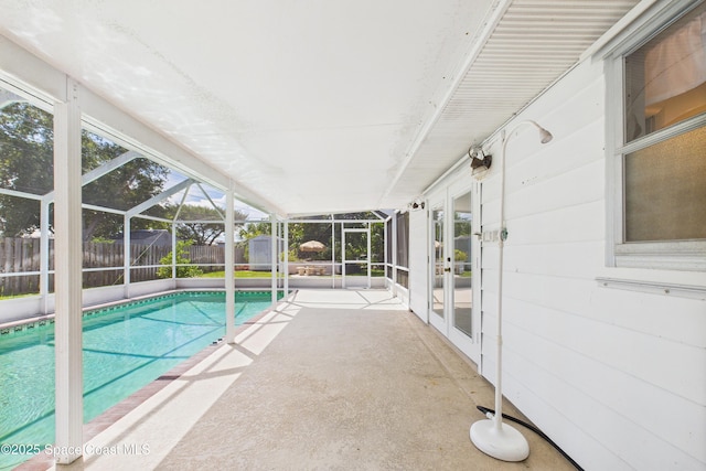 959 Eyerly Ln NE, Palm Bay, FL 32905 - view of pool featuring french doors, a shed, a fenced backyard, a patio area, and a lanai