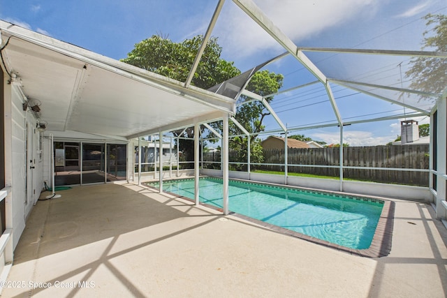 959 Eyerly Ln NE, Palm Bay, FL 32905 - view of pool featuring a patio area, a fenced backyard, and a lanai