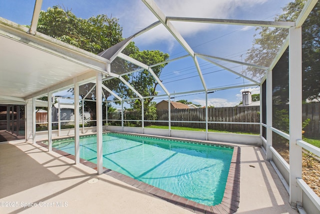 959 Eyerly Ln NE, Palm Bay, FL 32905 - view of pool featuring a fenced backyard, a patio, and glass enclosure