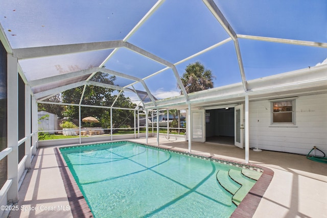 959 Eyerly Ln NE, Palm Bay, FL 32905 - outdoor pool with a patio area and glass enclosure