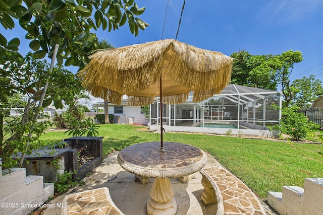 959 Eyerly Ln NE, Palm Bay, FL 32905 - fenced yard with a patio and glass enclosure