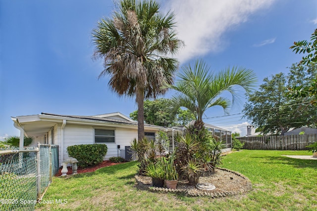 959 Eyerly Ln NE, Palm Bay, FL 32905 - fenced backyard featuring glass enclosure