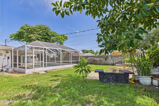 959 Eyerly Ln NE, Palm Bay, FL 32905 - fenced backyard featuring a patio and a lanai